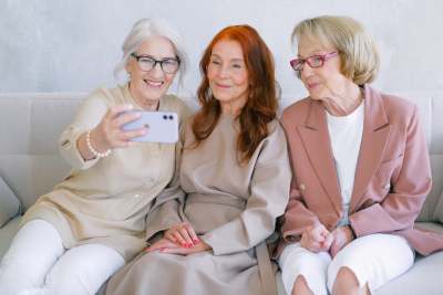 Three older women taking a selfie on mobile phone