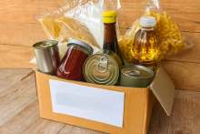 Cardboard box with non perishable groceries inside